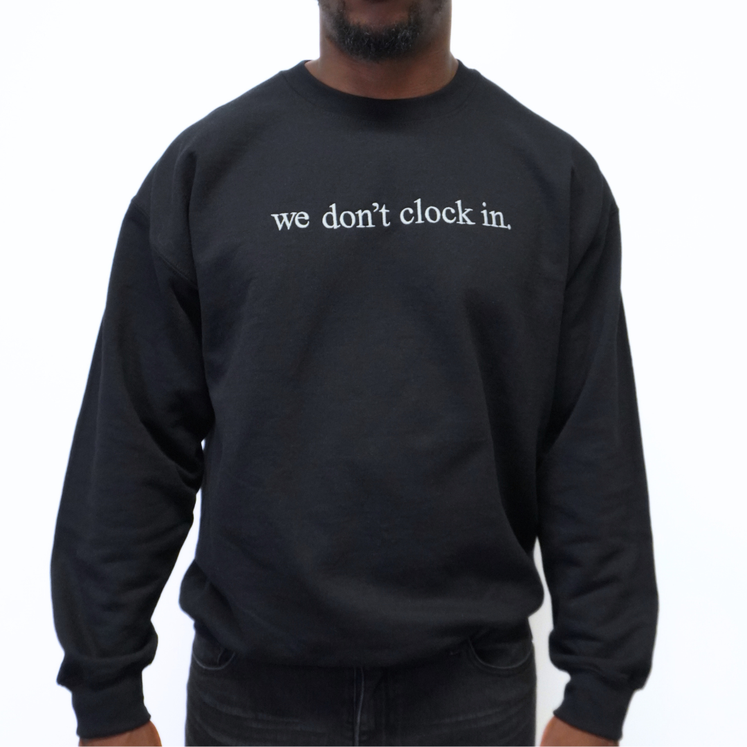 Our "we don't clock in." black crewneck is made from.... This comfortable and stylish crewneck has been crafted for repeat wear and reflects the intersection of timeless fashion and durability. Crafted with care and precision, its minimalist design allows the powerful statement "we don't clock in." to take center stage, making it a conversation starter wherever you go. Wear with pride, knowing that you're not just wearing a garment, but a symbol of independence and self-determination.