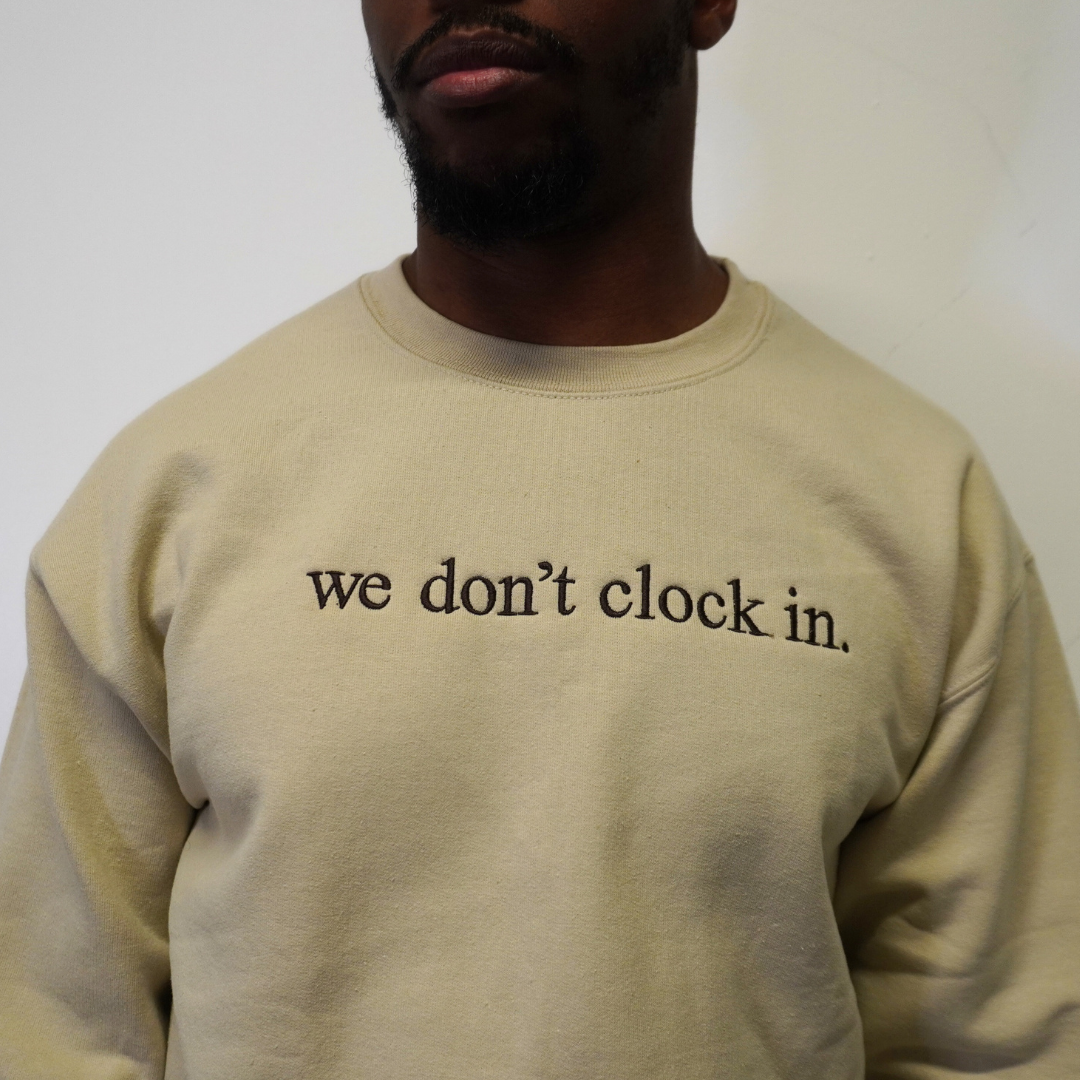 Our "we don't clock in." cream crewneck is made from.... This comfortable and stylish crewneck has been crafted for repeat wear and reflects the intersection of timeless fashion and durability. Crafted with care and precision, its minimalist design allows the powerful statement "we don't clock in." to take center stage, making it a conversation starter wherever you go. Wear with pride, knowing that you're not just wearing a garment, but a symbol of independence and self-determination.