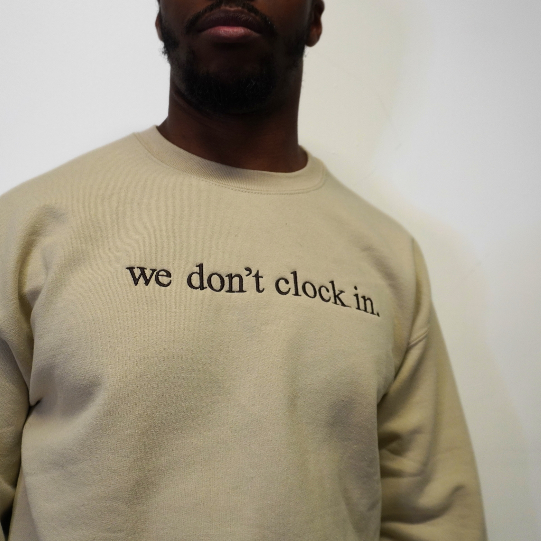 Our "we don't clock in." cream crewneck is made from.... This comfortable and stylish crewneck has been crafted for repeat wear and reflects the intersection of timeless fashion and durability. Crafted with care and precision, its minimalist design allows the powerful statement "we don't clock in." to take center stage, making it a conversation starter wherever you go. Wear with pride, knowing that you're not just wearing a garment, but a symbol of independence and self-determination.