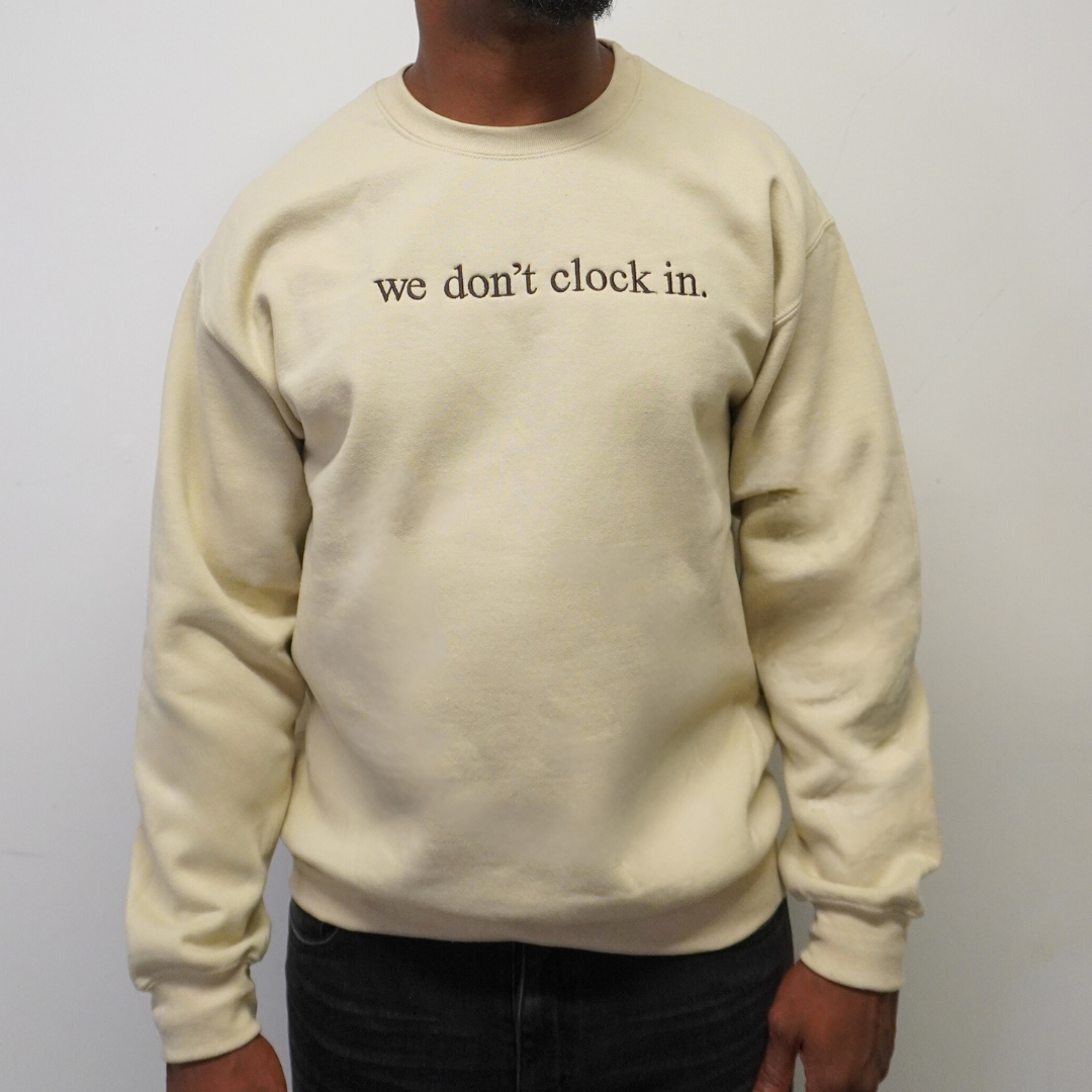 Our "we don't clock in." cream crewneck is made from.... This comfortable and stylish crewneck has been crafted for repeat wear and reflects the intersection of timeless fashion and durability. Crafted with care and precision, its minimalist design allows the powerful statement "we don't clock in." to take center stage, making it a conversation starter wherever you go. Wear with pride, knowing that you're not just wearing a garment, but a symbol of independence and self-determination.