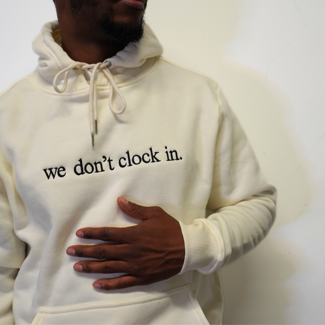 Our "we don't clock in." hoodie is made from.... This comfortable and stylish hoodie is a statement on longevity, quality, and durability. Crafted with care and precision, its minimalist design allows the powerful statement "we don't clock in." to take center stage, making it a conversation starter wherever you go.