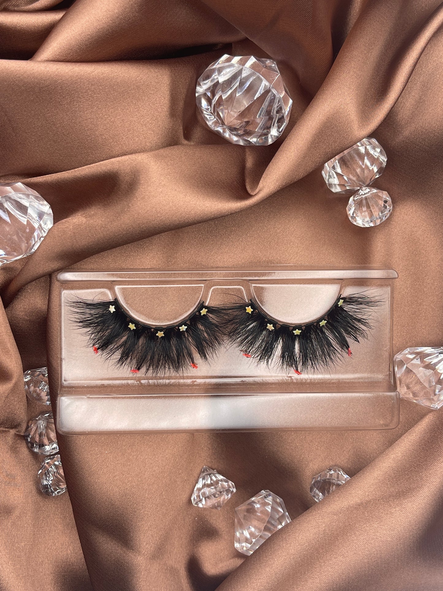 Looking for a lash with a little bling? These Teirrah Seinek Majestic lashes are for you. These 20mm fluffy, voluminous lashes are great with any outfit and will definitely turn heads.    Lash Length: 20mm Full Strip Lashes