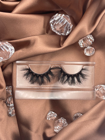 These Extravagance lashes by Teirrah Seinek are for those of us who love to be extra. These 22mm wispy lashes are perfect for a night out. Long lasting and re-usable up to 20+ times with proper care.  Lash Length: 22mm Full Strip Lashes