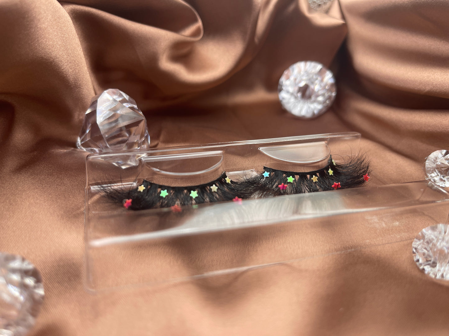 Looking for a lash with a little bling? These Teirrah Seinek Majestic lashes are for you. These 20mm fluffy, voluminous lashes are great with any outfit and will definitely turn heads.    Lash Length: 20mm Full Strip Lashes