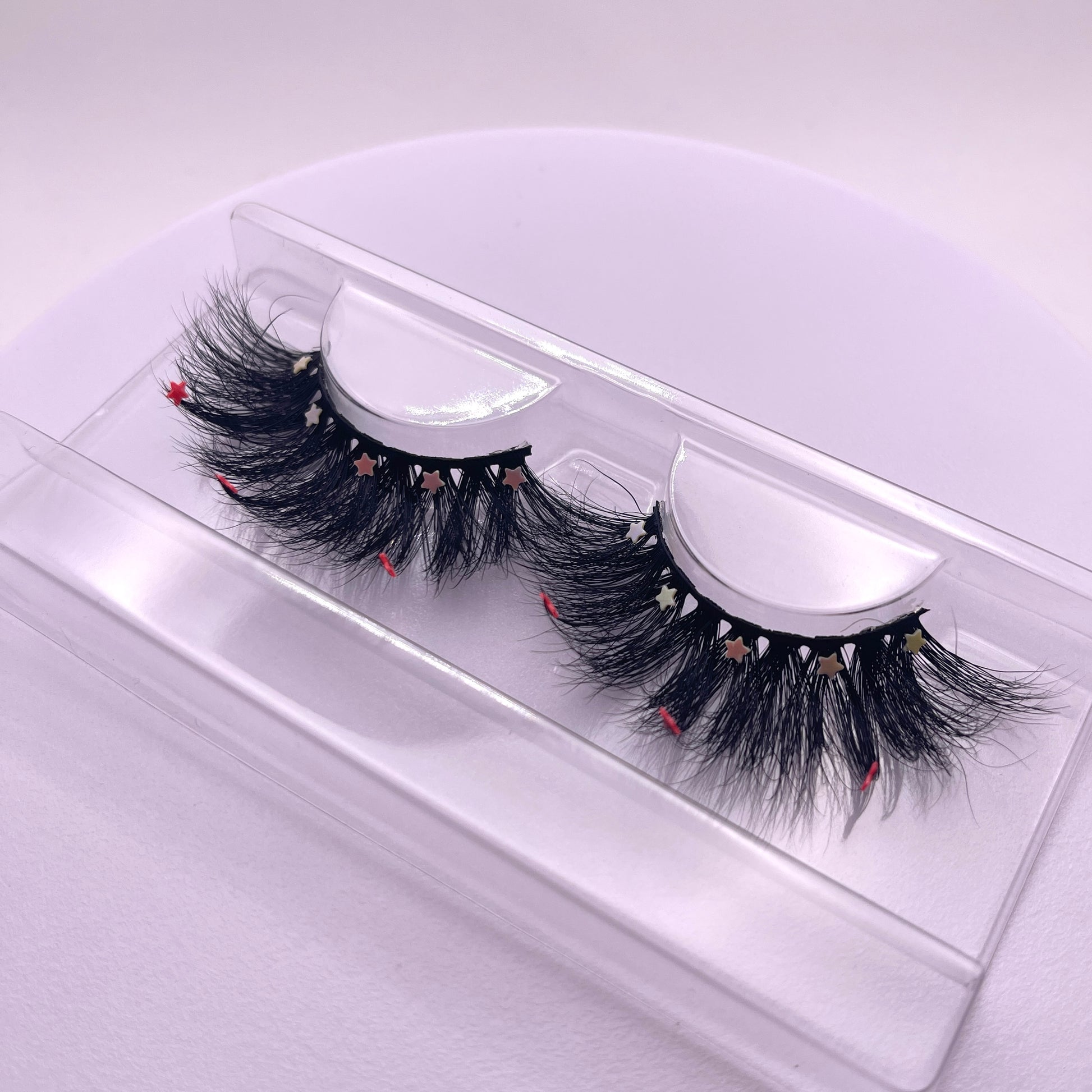 Looking for a lash with a little bling? These Teirrah Seinek Majestic lashes are for you. These 20mm fluffy, voluminous lashes are great with any outfit and will definitely turn heads.    Lash Length: 20mm Full Strip Lashes